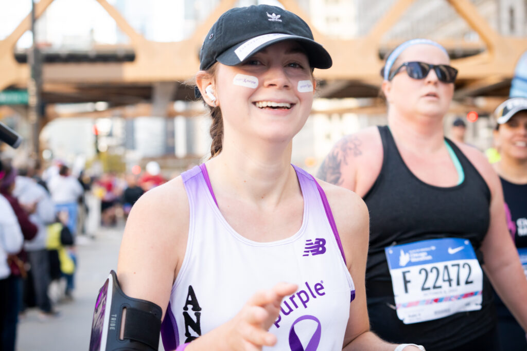Runner at Chicago Marathon representing pancreatic cancer charity Project Purple
