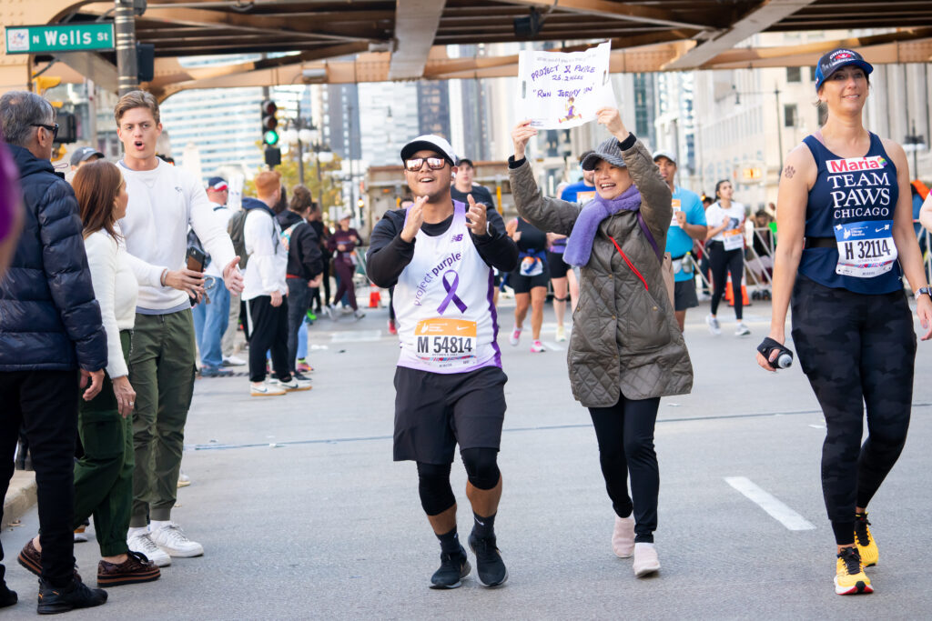 Project Purple Runner Clapping & Cheering at the Chicago Marathon