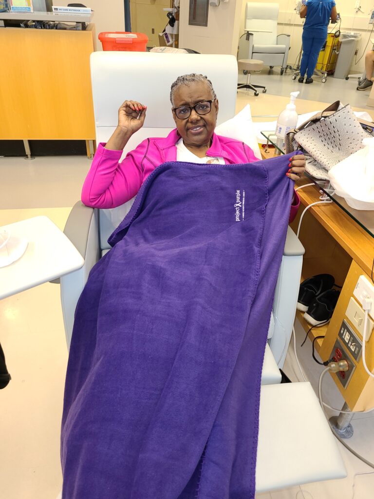 Pancreatic Cnacer Patient Tarra Harris with her Project Purple Blanket of Hope that she brought for chemotherapy treatment.