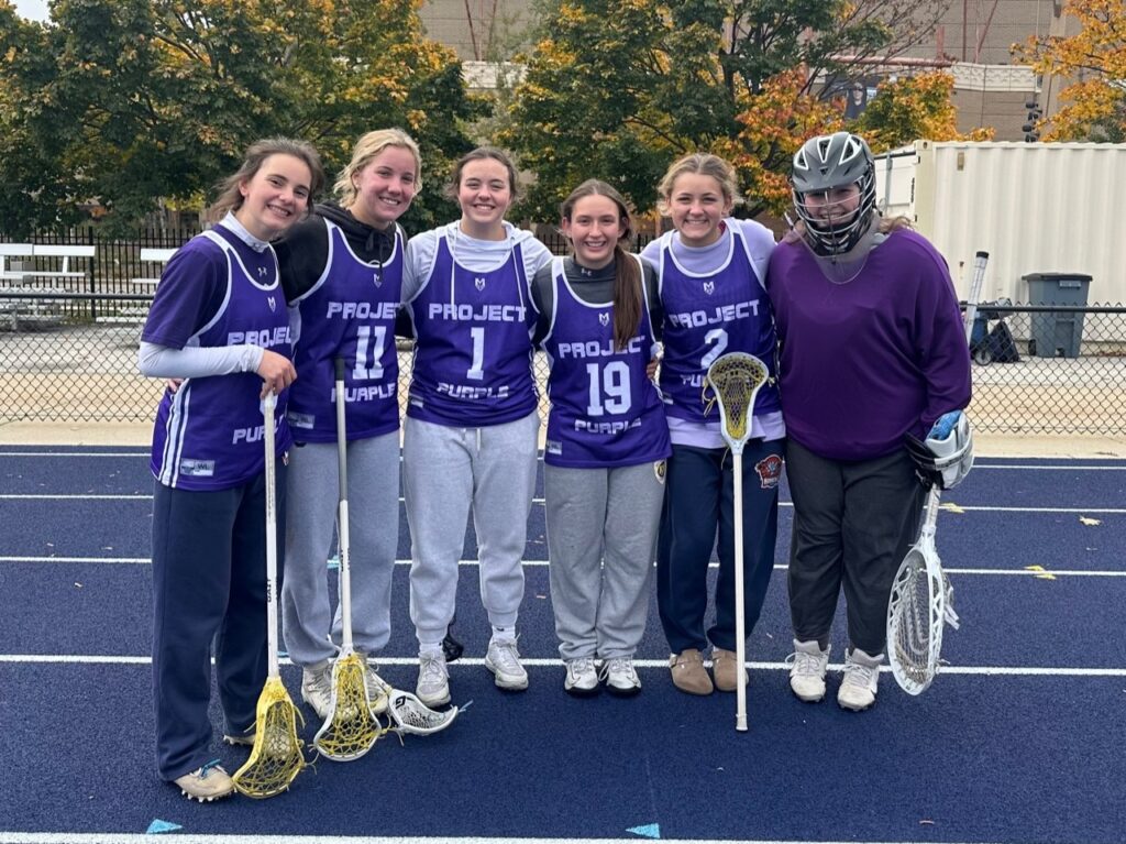 Ella Mautz and her teammates with their Project Purple themed jerseys to spread pancreatic cancer awareness