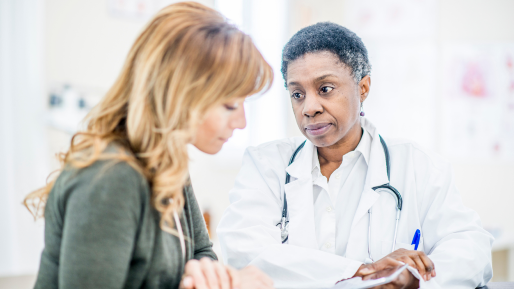 doctor delivering news of pancreatic cancer diagnosis stock image