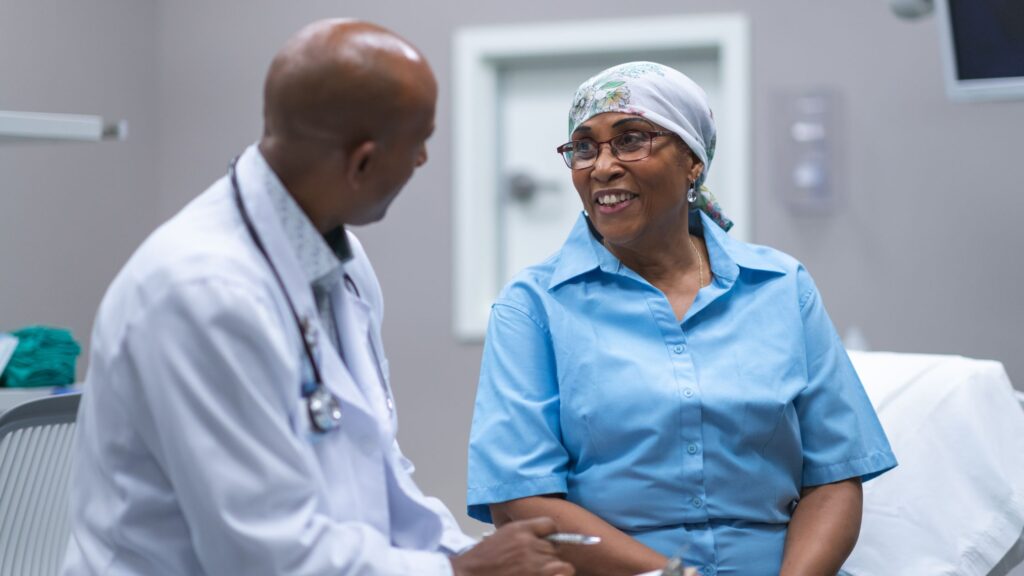 doctor and woman in hospital discussing pancreatic cancer