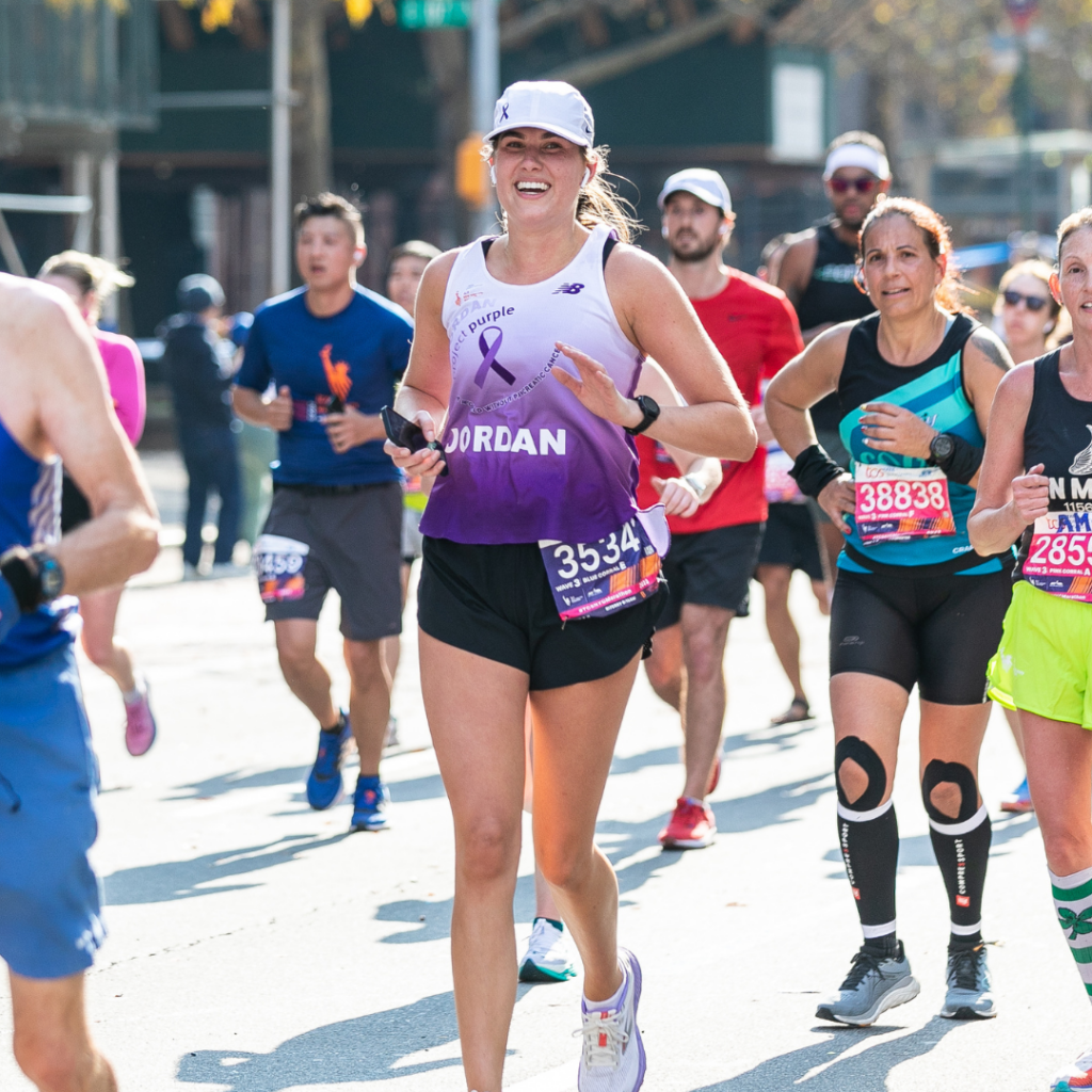 Jordan Serati Running Through Manhattan in Project Purple singlet